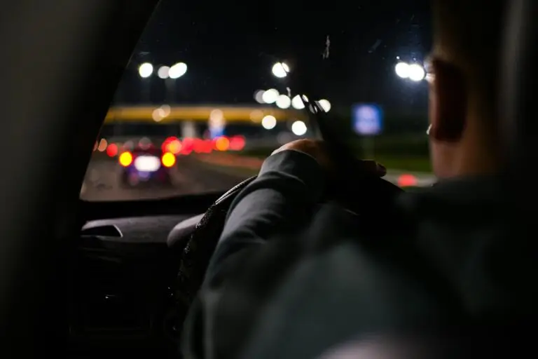 Man driving a car at night